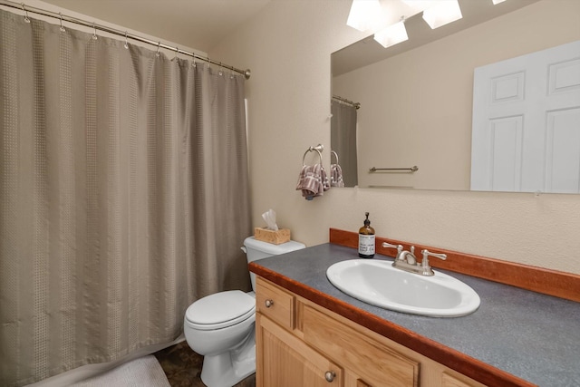 full bathroom with vanity, toilet, and curtained shower