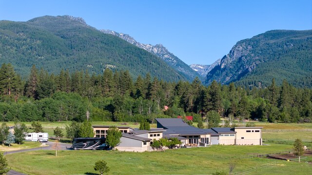 view of mountain backdrop with a forest