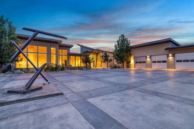 view of pool at dusk