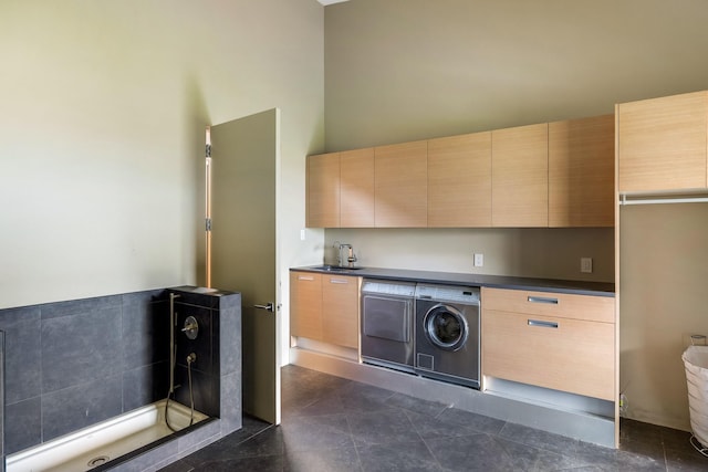 laundry area featuring washer / dryer and a high ceiling