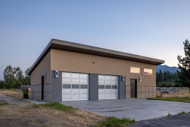 detached garage with a mountain view