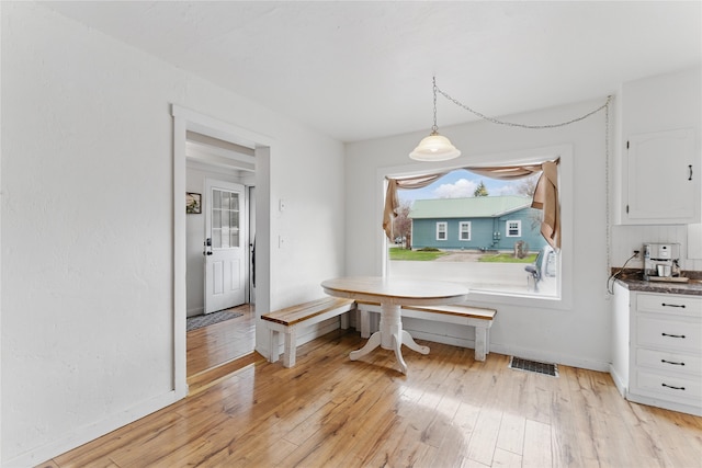 648 7th Ave W, Kalispell, MT 59901 - dining area with light wood-style floors and baseboards