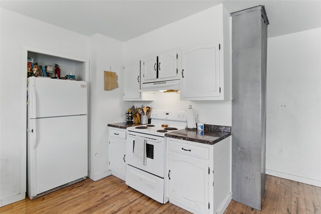 648 7th Ave W, Kalispell, MT 59901 - kitchen featuring white appliances, under cabinet range hood, dark countertops, white cabinets, and light wood-type flooring