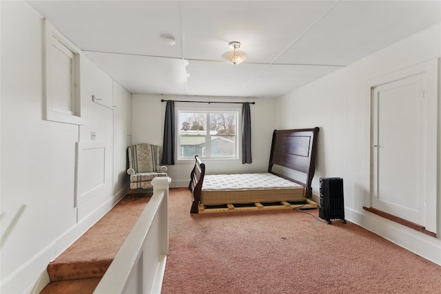 648 7th Ave W, Kalispell, MT 59901 - bedroom featuring carpet flooring, baseboards, and radiator