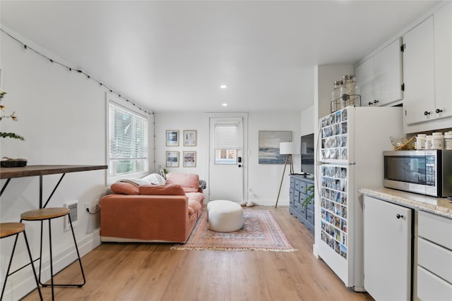 648 7th Ave W, Kalispell, MT 59901 - living area featuring light wood-type flooring, recessed lighting, and baseboards