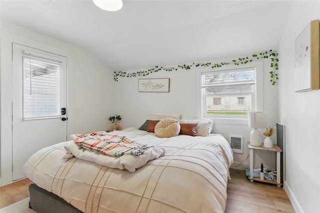 648 7th Ave W, Kalispell, MT 59901 - bedroom with light wood-type flooring and vaulted ceiling