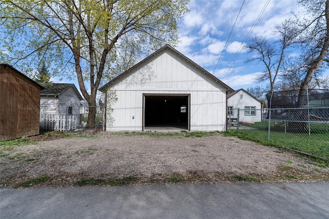 648 7th Ave W, Kalispell, MT 59901 - detached garage featuring fence and dirt driveway