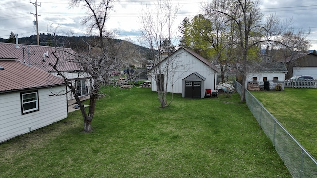 648 7th Ave W, Kalispell, MT 59901 - view of yard featuring an outdoor structure and a storage shed