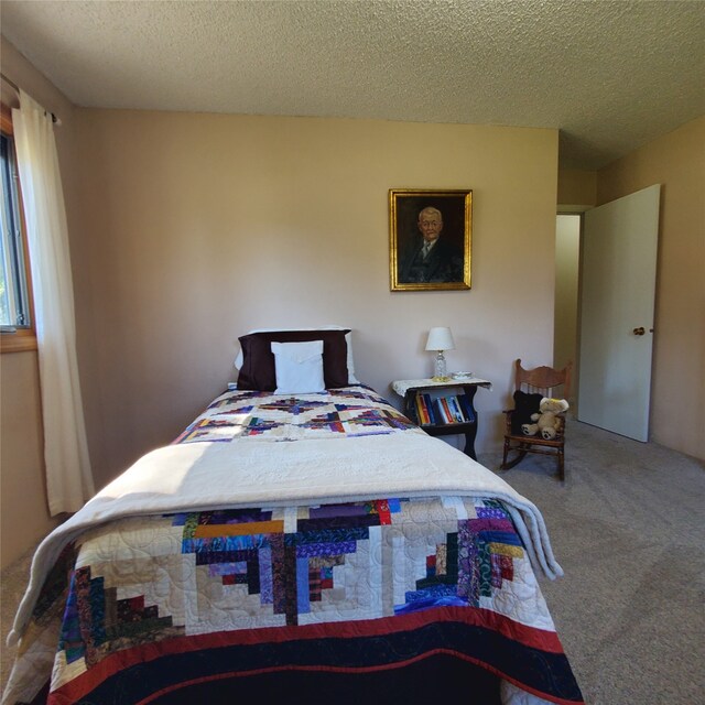 3208 Paul Ln, Missoula, MT 59803 - carpeted bedroom featuring a textured ceiling