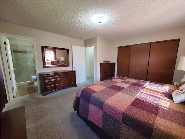 3208 Paul Ln, Missoula, MT 59803 - carpeted bedroom featuring a textured ceiling, ensuite bathroom, and a closet