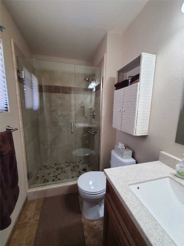 3208 Paul Ln, Missoula, MT 59803 - full bathroom featuring a shower stall, toilet, and vanity