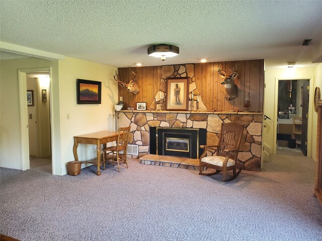 3208 Paul Ln, Missoula, MT 59803 - living room featuring visible vents, a textured ceiling, carpet, and a fireplace