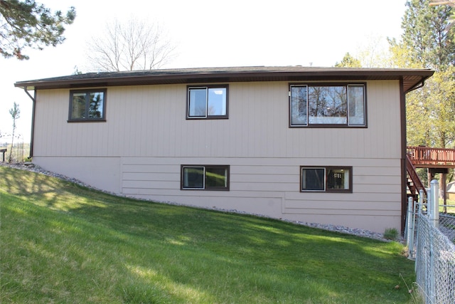 3208 Paul Ln, Missoula, MT 59803 - back of house with fence, stairway, a deck, and a yard