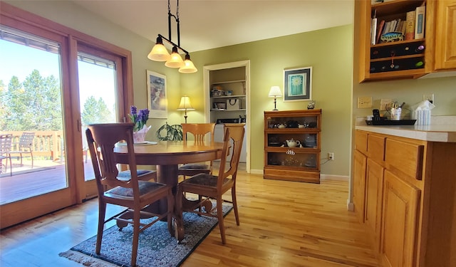 3208 Paul Ln, Missoula, MT 59803 - dining space with visible vents, light wood finished floors, and built in features