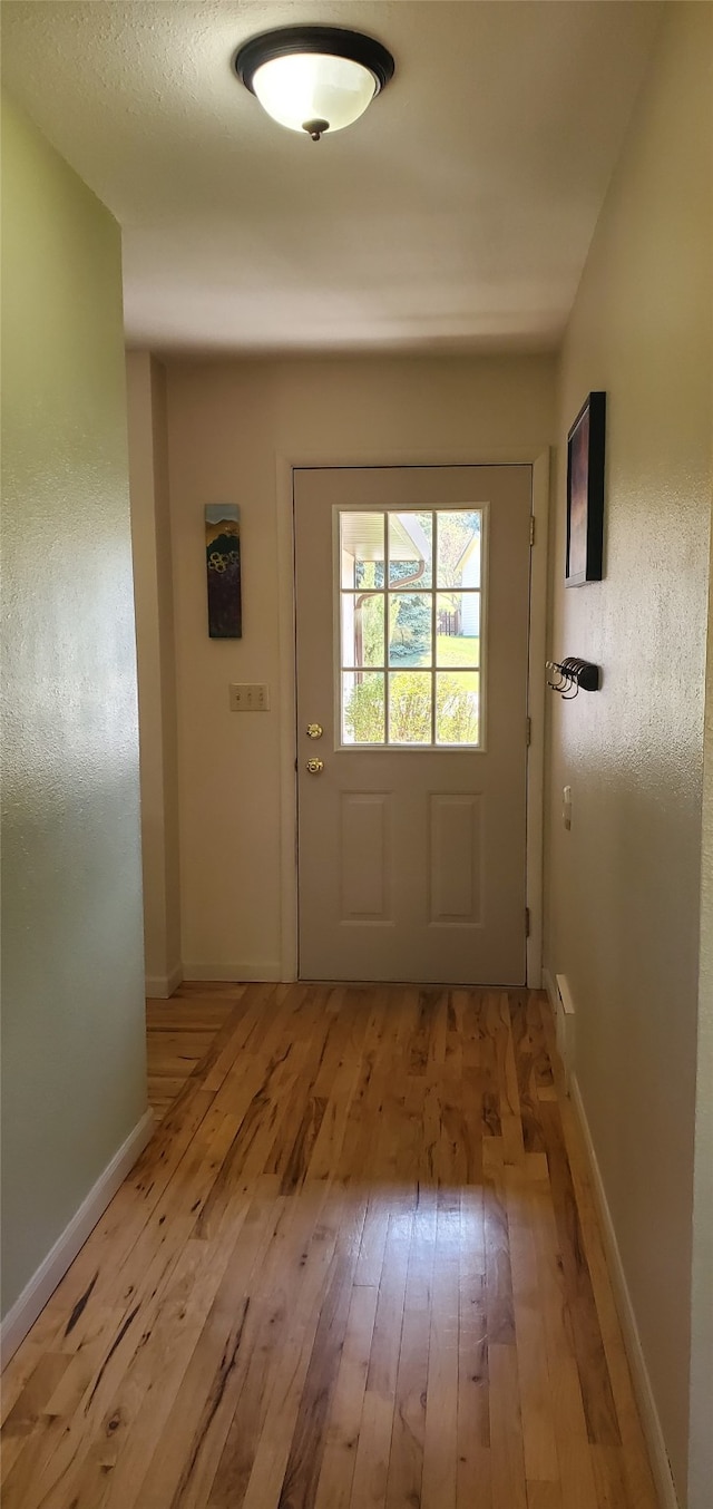 3208 Paul Ln, Missoula, MT 59803 - entryway with baseboards and light wood finished floors