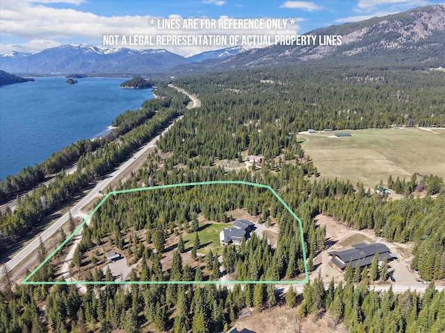 15 Copper Ridge Rd, Trout Creek, MT 59874 - aerial view of property and surrounding area with a forest, a water and mountain view, and property parcel outlined