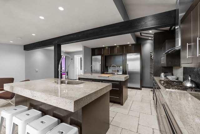 15 Copper Ridge Rd, Trout Creek, MT 59874 - kitchen featuring a kitchen island with sink, a sink, stone tile flooring, appliances with stainless steel finishes, and recessed lighting