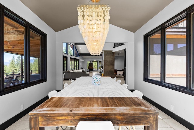 15 Copper Ridge Rd, Trout Creek, MT 59874 - dining space with lofted ceiling, a chandelier, and baseboards