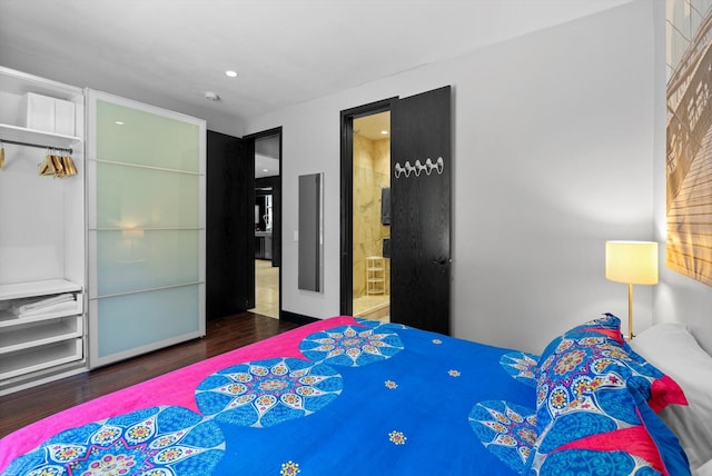 15 Copper Ridge Rd, Trout Creek, MT 59874 - bedroom with wood finished floors, recessed lighting, and ensuite bathroom