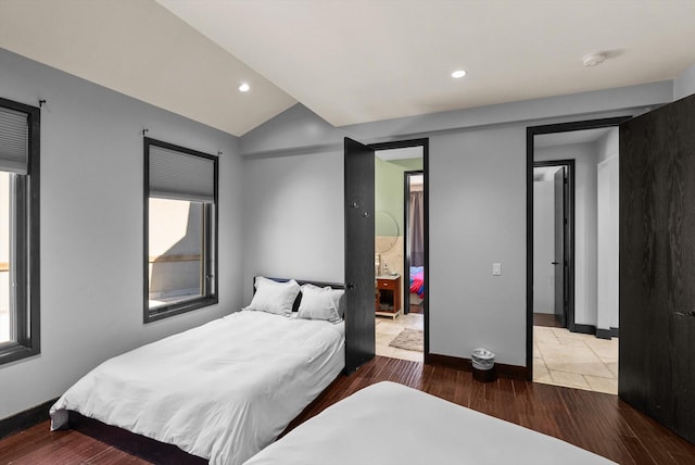 15 Copper Ridge Rd, Trout Creek, MT 59874 - bedroom featuring wood finished floors, lofted ceiling, baseboards, recessed lighting, and multiple windows