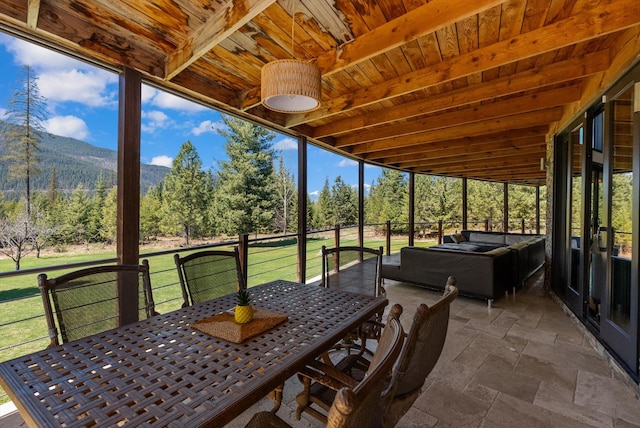 15 Copper Ridge Rd, Trout Creek, MT 59874 - sunroom / solarium featuring outdoor dining area, a mountain view, and beamed ceiling