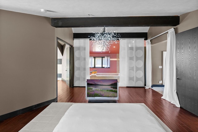 15 Copper Ridge Rd, Trout Creek, MT 59874 - bedroom featuring beam ceiling, a chandelier, wood finished floors, and baseboards