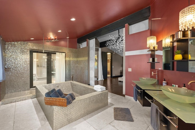 15 Copper Ridge Rd, Trout Creek, MT 59874 - full bathroom featuring a chandelier, recessed lighting, a garden tub, double vanity, and walk in shower