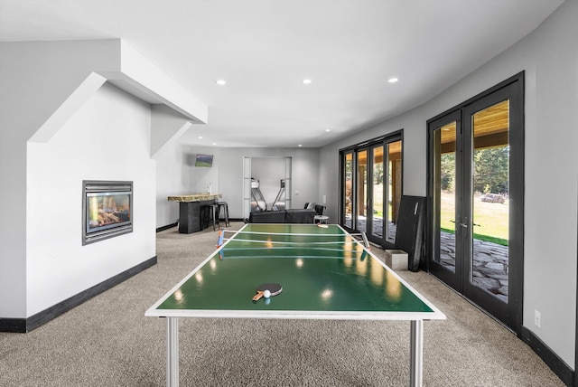 15 Copper Ridge Rd, Trout Creek, MT 59874 - recreation room with french doors, carpet flooring, recessed lighting, a glass covered fireplace, and baseboards
