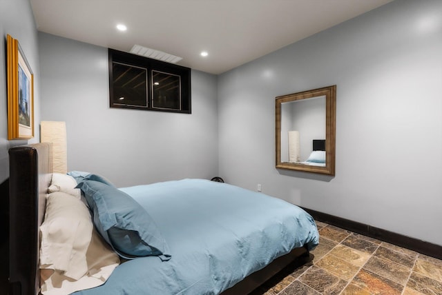 15 Copper Ridge Rd, Trout Creek, MT 59874 - bedroom featuring baseboards, stone tile flooring, and recessed lighting
