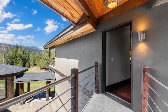 15 Copper Ridge Rd, Trout Creek, MT 59874 - doorway to property featuring a mountain view, a balcony, and stucco siding