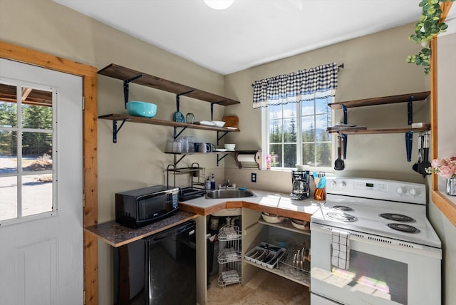 15 Copper Ridge Rd, Trout Creek, MT 59874 - kitchen featuring white range with electric cooktop, black microwave, plenty of natural light, and open shelves