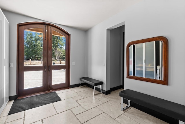 15 Copper Ridge Rd, Trout Creek, MT 59874 - entryway featuring french doors, baseboards, and stone tile floors
