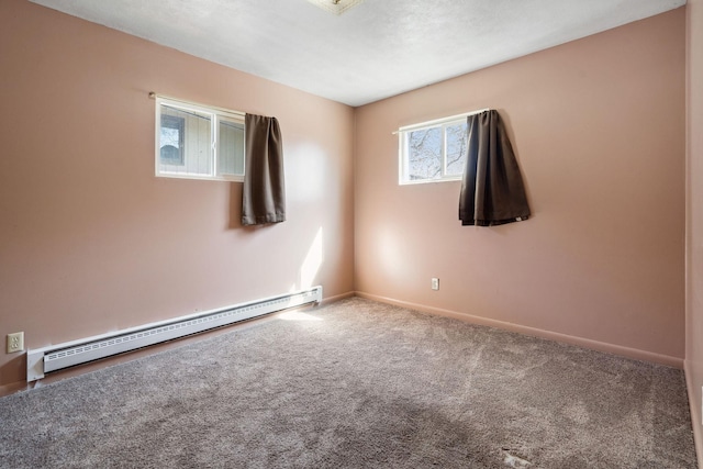 carpeted empty room featuring a baseboard radiator and baseboards