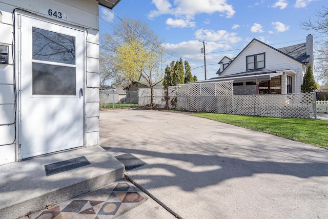 view of patio / terrace featuring fence
