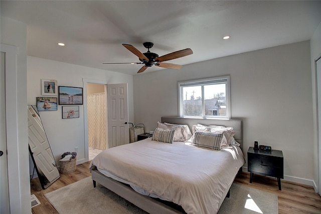 bedroom with recessed lighting, ceiling fan, baseboards, and light wood-type flooring