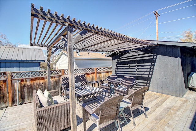 wooden terrace featuring fence, a pergola, and an outdoor living space