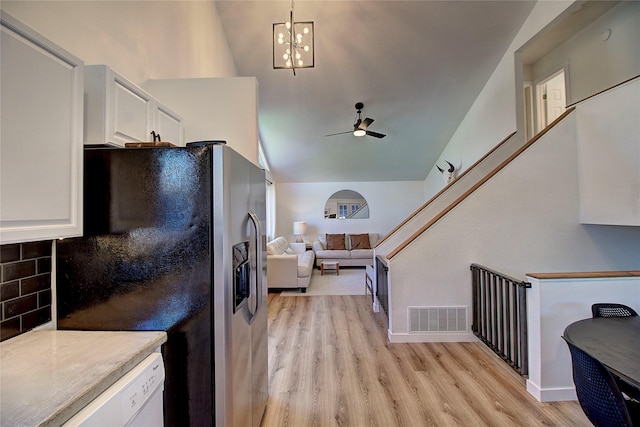kitchen featuring light wood-style floors, white cabinets, visible vents, stainless steel refrigerator with ice dispenser, and a ceiling fan