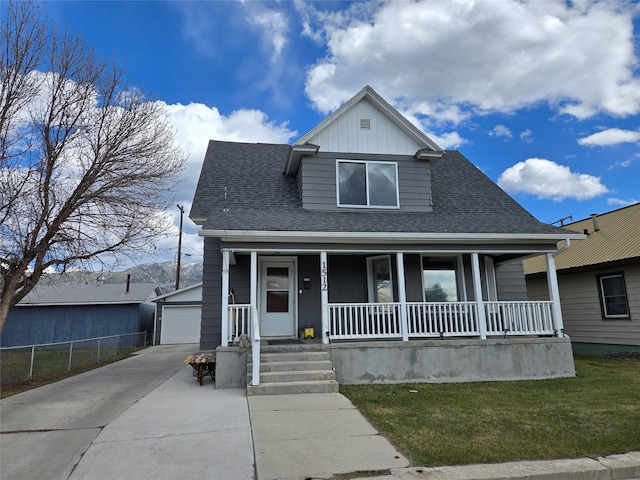 1512 Gaylord St, Butte, MT 59701 - bungalow with an outbuilding, a garage, covered porch, and roof with shingles
