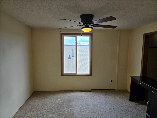 1512 Gaylord St, Butte, MT 59701 - unfurnished living room with a textured ceiling, visible vents, ceiling fan, and light carpet