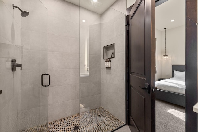 bathroom featuring ensuite bathroom and a stall shower