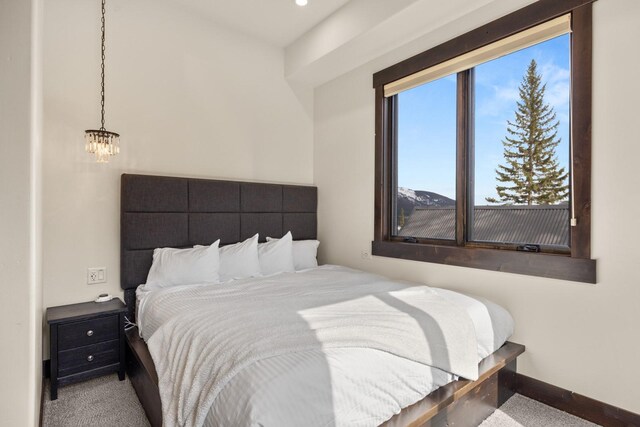 bedroom with baseboards and carpet floors