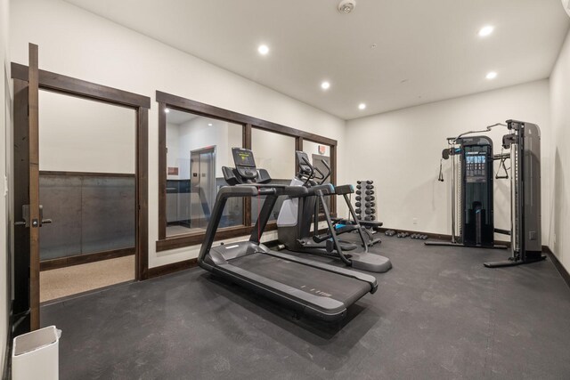exercise room featuring baseboards and recessed lighting