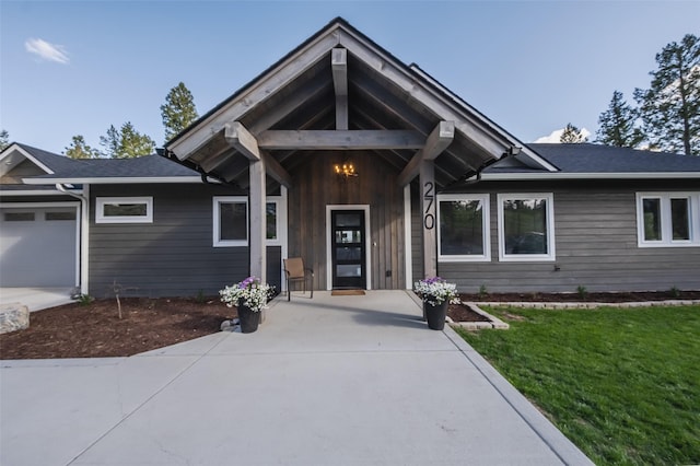 270 Westridge Dr, Somers, MT 59932 - view of front of home featuring a front lawn and an attached garage