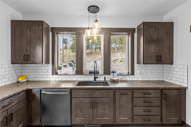 270 Westridge Dr, Somers, MT 59932 - kitchen with decorative backsplash, dark countertops, stainless steel dishwasher, and a sink