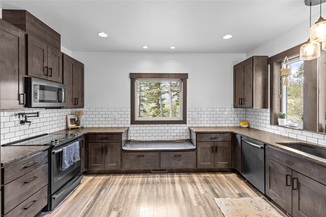 270 Westridge Dr, Somers, MT 59932 - kitchen with appliances with stainless steel finishes, light wood-style floors, and dark brown cabinets