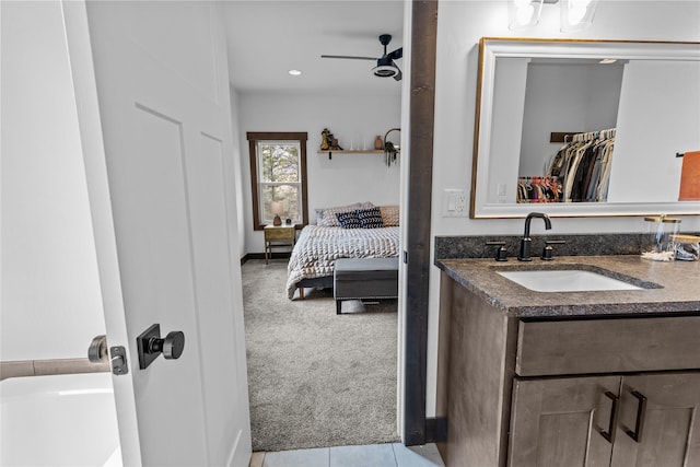 270 Westridge Dr, Somers, MT 59932 - ensuite bathroom featuring ceiling fan, connected bathroom, tile patterned flooring, and vanity