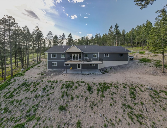 270 Westridge Dr, Somers, MT 59932 - rear view of house with a wooden deck and a patio area