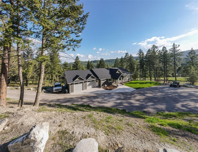 270 Westridge Dr, Somers, MT 59932 - view of front facade with driveway and a garage
