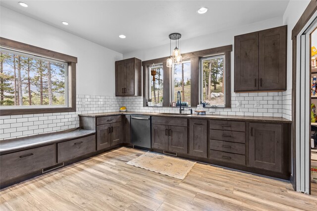 270 Westridge Dr, Somers, MT 59932 - kitchen with stainless steel dishwasher, dark brown cabinetry, a sink, and a wealth of natural light