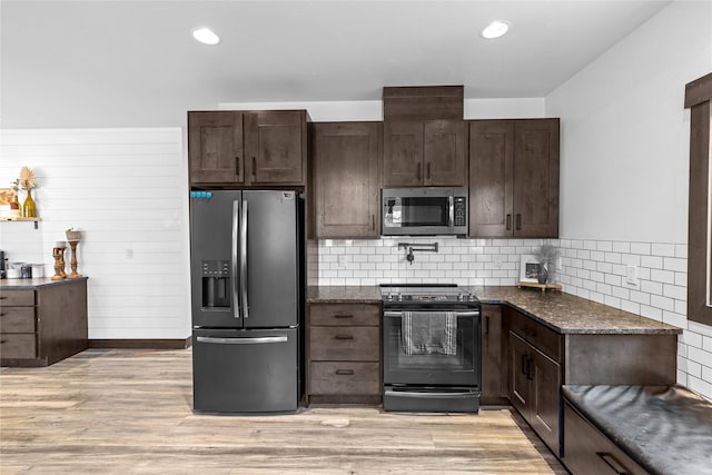 270 Westridge Dr, Somers, MT 59932 - kitchen featuring dark brown cabinetry, light wood-style floors, and appliances with stainless steel finishes